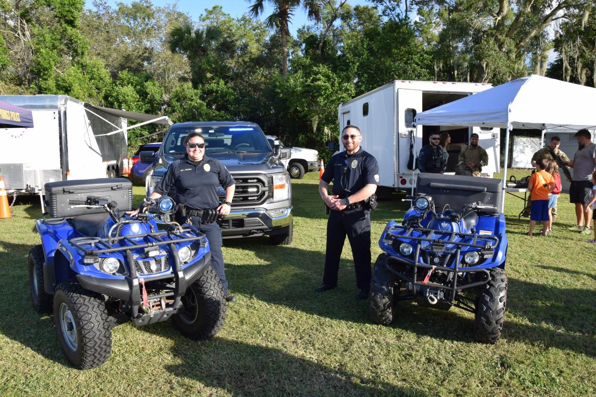 WSPD officers at Hometown Harvest standing next to two police ATVs
